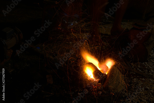 Orange streak line from burning charcoal flame