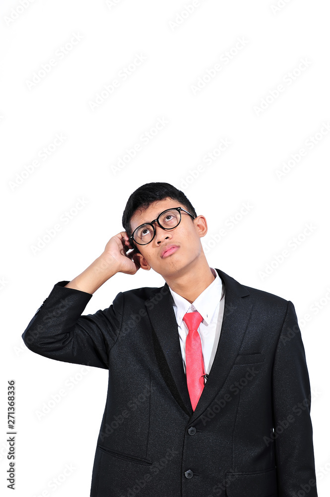 Asian young businessman thinking about question, hand on head, pensive expression. Confusion with thoughtful face. Doubt concept. Asian young businessman thinking about question, hand on head, pensive expression. Confusion with thoughtful face. Doubt concept.