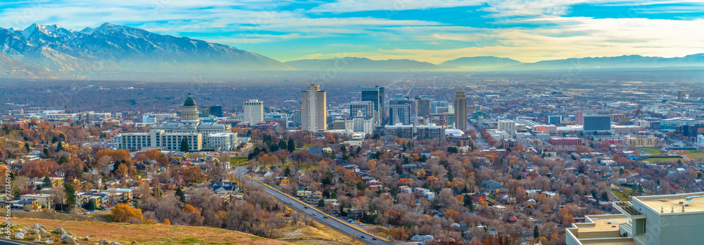 Utah State Capital Building and skyscrapers towering over the populous city - obrazy, fototapety, plakaty 