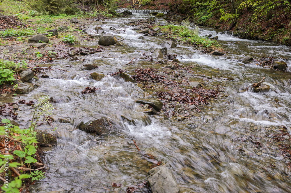 Cascades of pure mountain river among the stones Cascades of pure mountain river among the stones