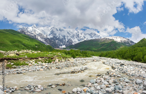 Svaneti wild mountains landscape. Wild mountain river in Georgia. Summer nature in Caucasus mountains. Scenic mountains on sunny day