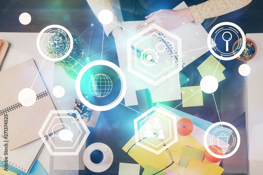 Social network theme hologram over hands taking notes background. Concept of global international people connect. Double exposure Social network theme hologram over hands taking notes background. Concept of global international people connect. Double exposure