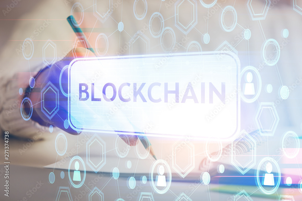 Cryptocurrency hologram, bitcoin, ico theme over hands taking notes background. Concept of blockchain. Multi exposure Cryptocurrency hologram, bitcoin, ico theme over hands taking notes background. Concept of blockchain. Multi exposure