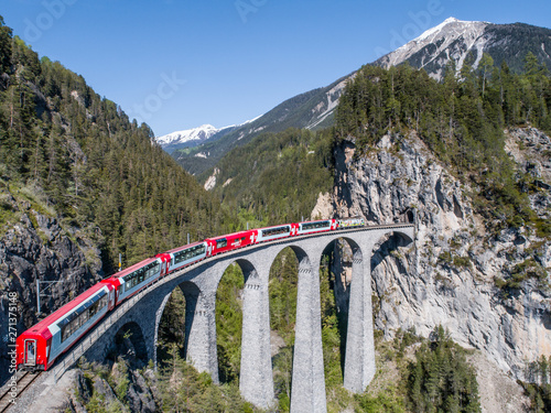 Bernina Express on Landwasser viaduct. Swiss Alps, Unesco World Heritage photo