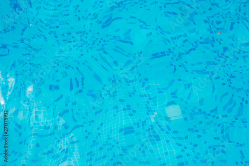Bright blue surface swimming pool water background