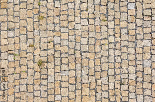 Old road paved with granite stones.