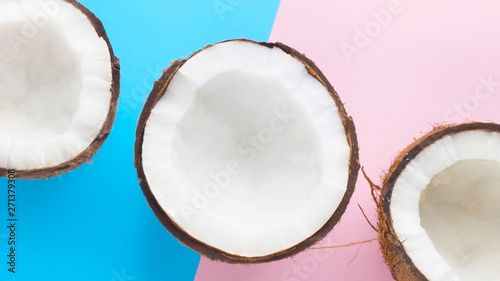 Three pieces of coconut on pink and blue background
