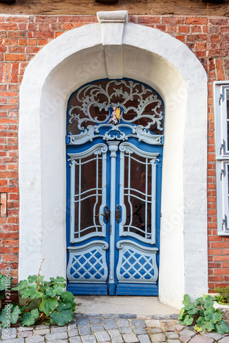 Old wooden front door in house. Luneburg. Germany photo