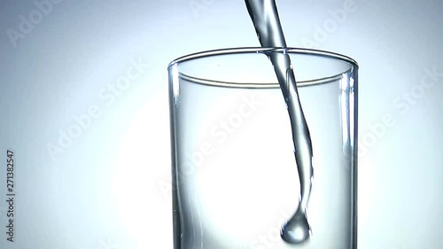 Clean Fresh Water Poured Into Glass, Backlit