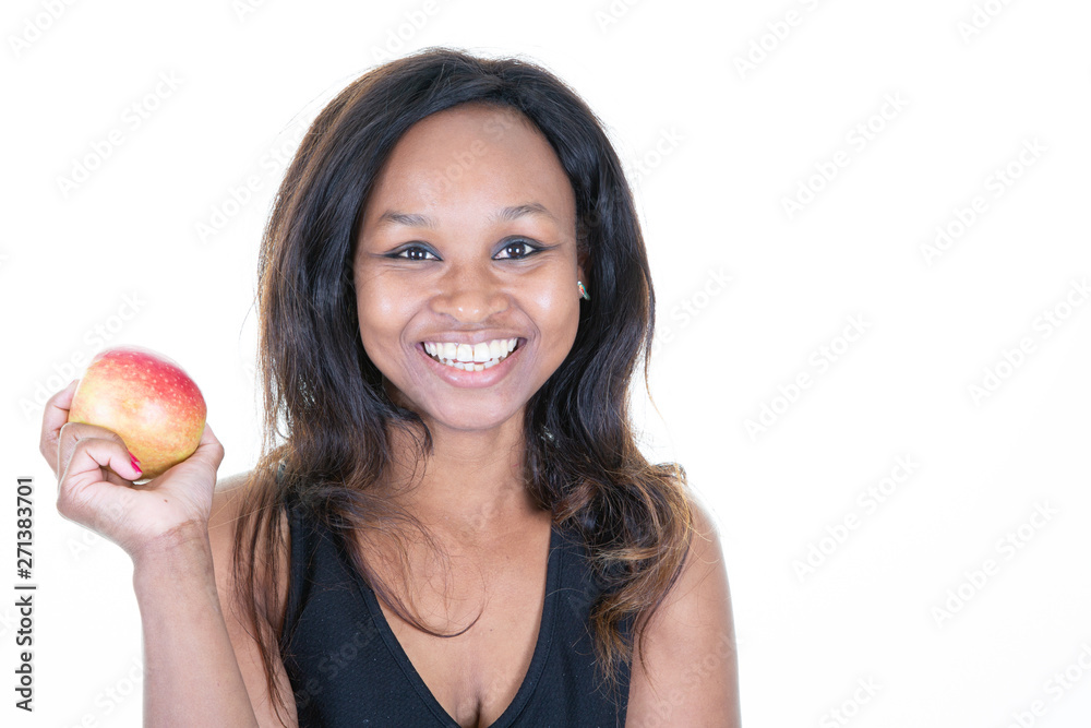 African American young woman holding for eating an apple African American young woman holding for eating an apple