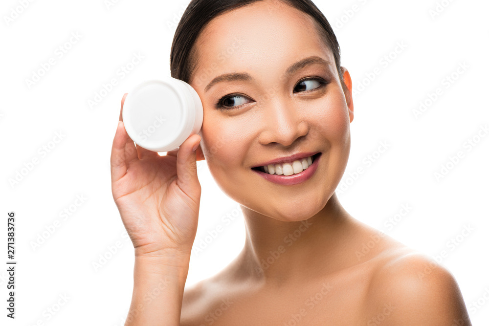 happy asian woman holding face cream, isolated on white happy asian woman holding face cream, isolated on white
