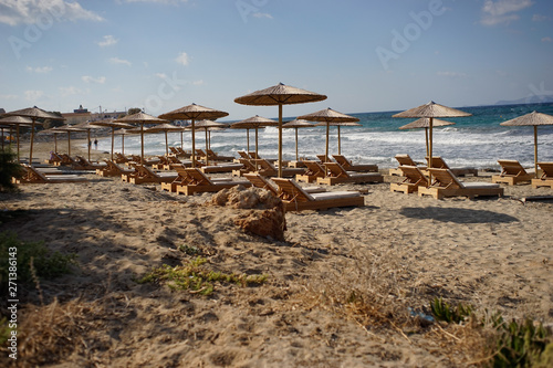 beach with chairs and umbrellas