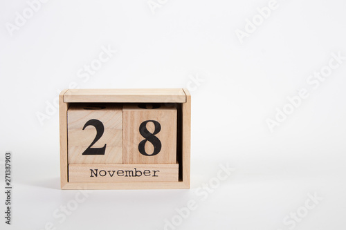 Wooden calendar November 28 on a white background