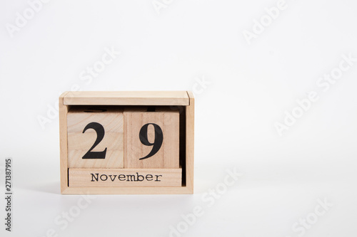 Wooden calendar November 29 on a white background