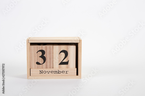 Wooden calendar November 32 on a white background