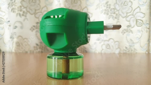 Electric fumigator for mosquito extermination. Anti-insect device. photo