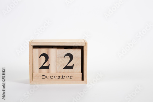 Wooden calendar December 22 on a white background