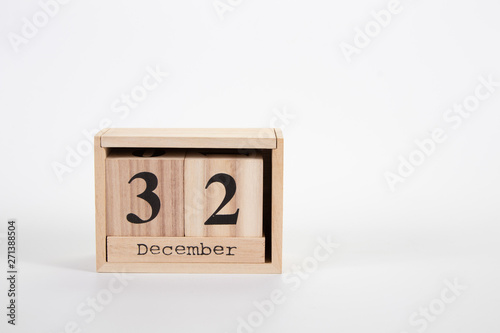 Wooden calendar December 32 on a white background