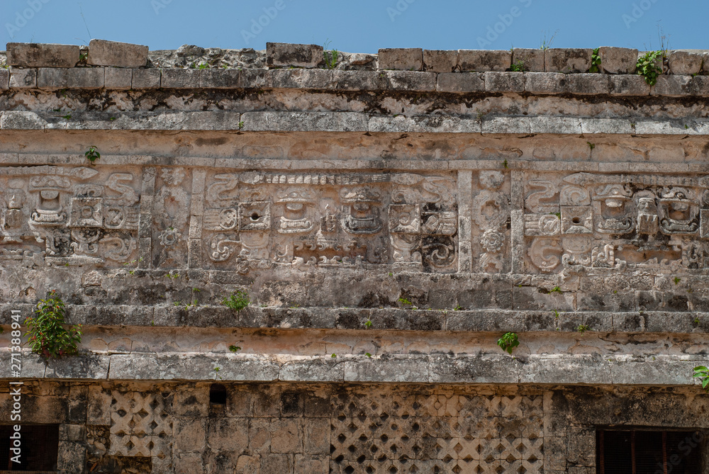 Detail of stone carvings of a Mayan temple, in the archaeological area of Chichen Itza, on the Yucatan peninsula