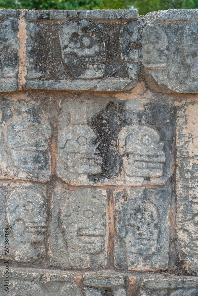 Details of skull engravings, on a Mayan temple, in the archaeological area of Chichen Itza, on the Yucatan peninsula