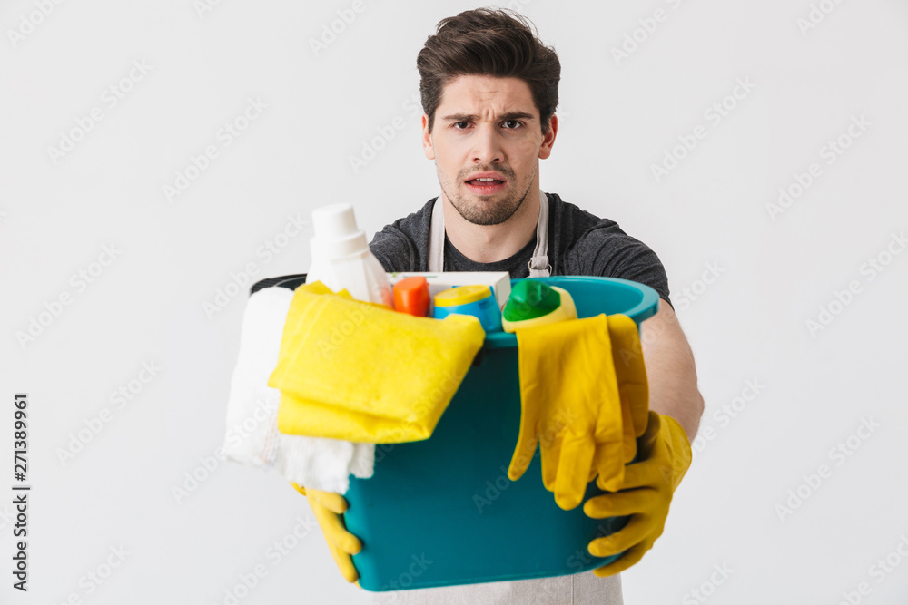 Handsome brunette houseman wearing apron Handsome brunette houseman wearing apron