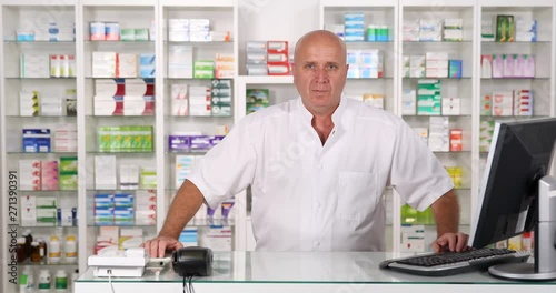 Wallpaper Mural Confident Pharmacist Stay Serious in a Drugstore Waiting and Listening a Client Torontodigital.ca