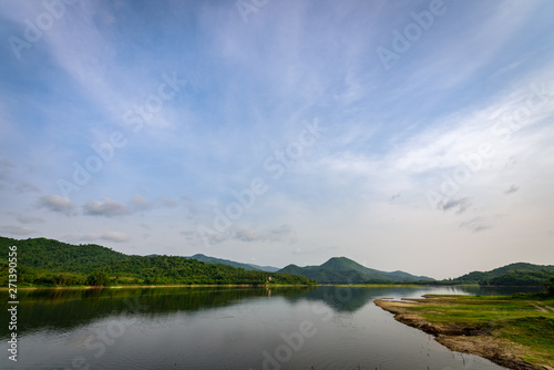 The landscape of nature with mountain, river, forest and clouds in the morning.