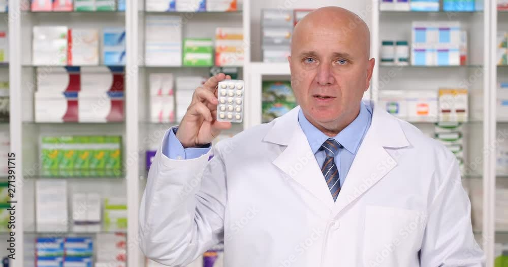 Pharmacist Keeping in Hand and Explaining About Medical Pills Consume and Abuse Pharmacist Keeping in Hand and Explaining About Medical Pills Consume and Abuse