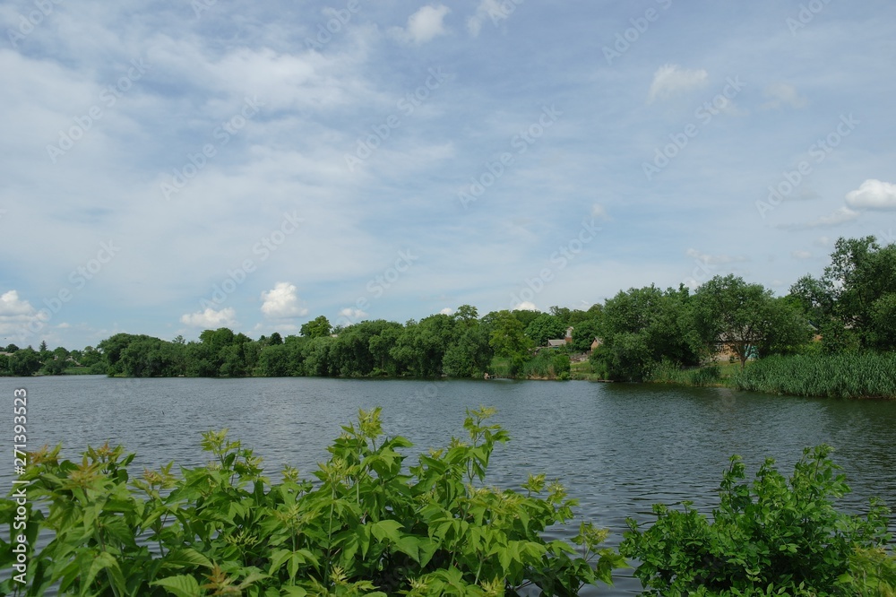 Summer landscape with river and clouds. Rural landscape. Summer landscape with river and clouds. Rural landscape.