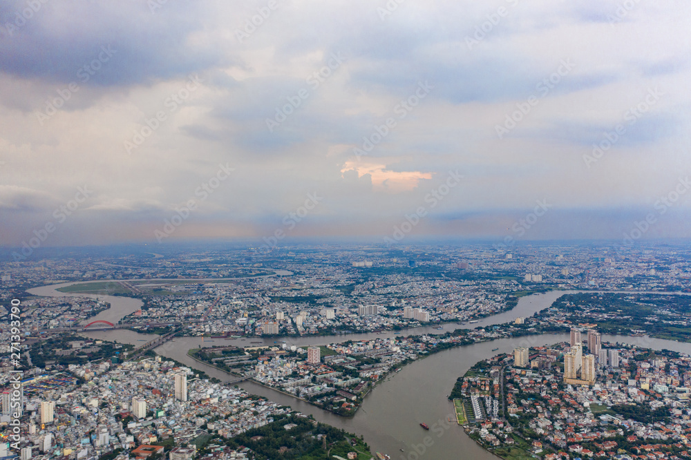 Top View of Building in a City - Aerial view Skyscrapers flying by drone of Ho Chi Mi City with development buildings, transportation, energy power infrastructure.