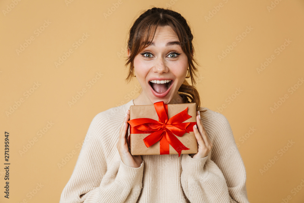 Fototapeta premium Beautiful young woman wearing sweater standing