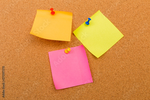 Cork board with pinned colored blank notes - Image .