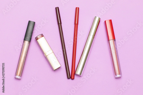 Items cosmetics for face on the lilac background