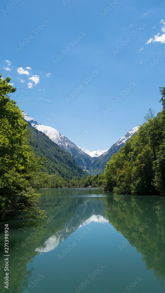 Beautiful scenery of Klammsee in Austrian alps with snowy mountains behind Beautiful scenery of Klammsee in Austrian alps with snowy mountains behind