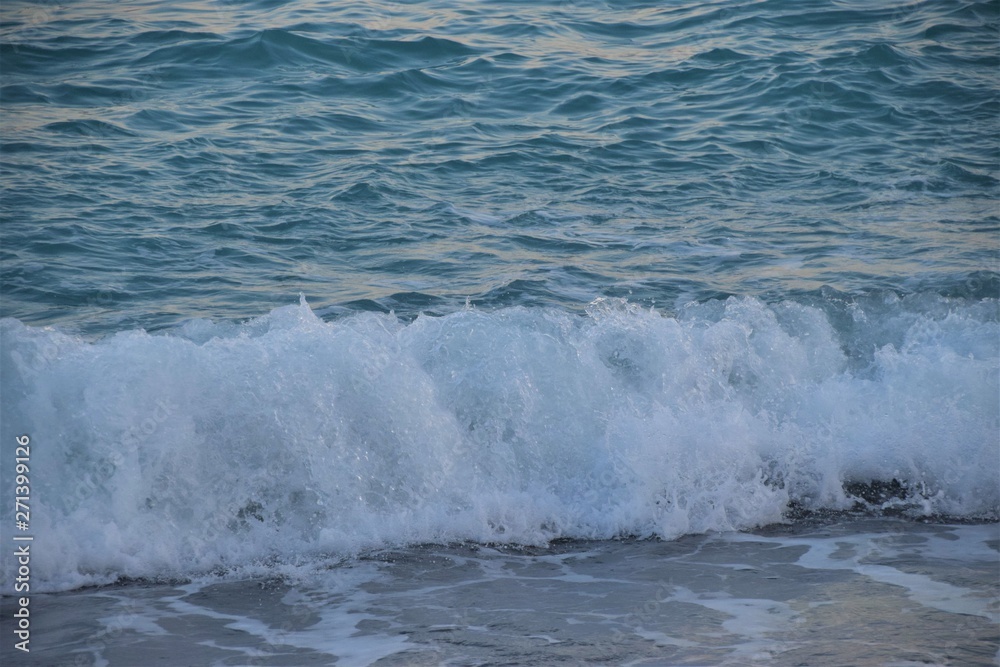 Sea waves splashing on beach water summer holiday