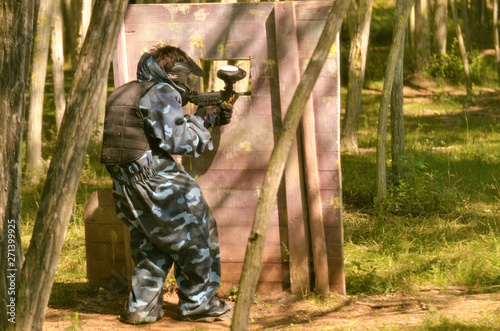Paintball battle. The battlefield is equipped with barriers
