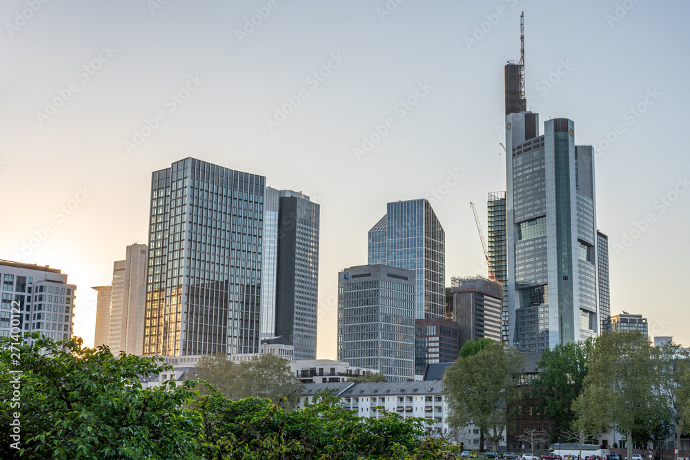 view on frankfurt skyline at sunset from eiserner steg bridge, frankfurt, hesse, germany view on frankfurt skyline at sunset from eiserner steg bridge, frankfurt, hesse, germany