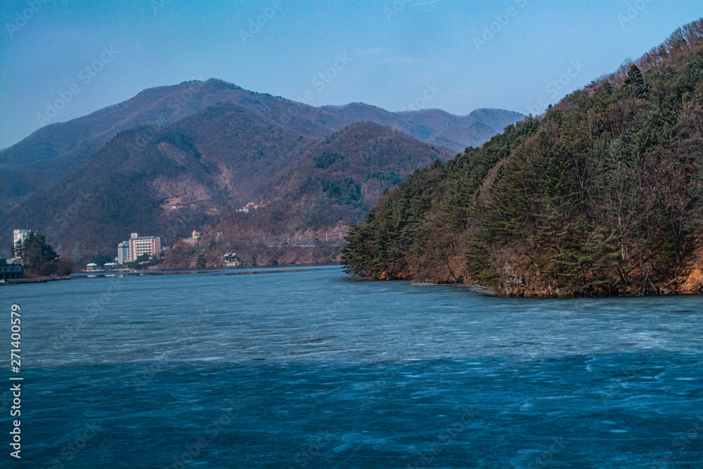 South Korea, 3 November 2014: The river turns into ice around Is a beautiful mountain