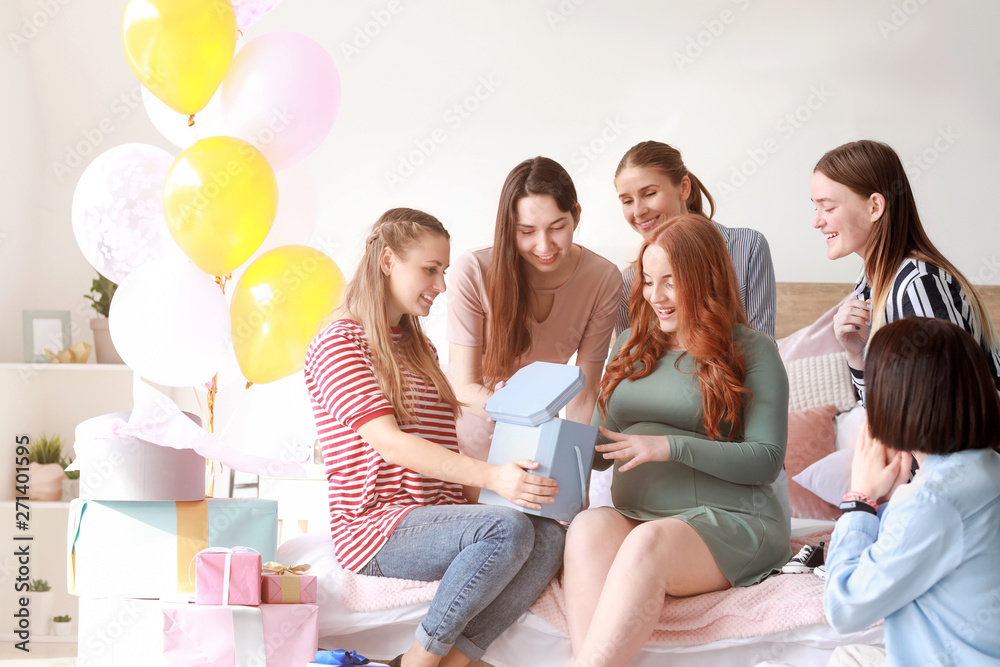 Beautiful pregnant woman and her friends at baby shower party - obrazy, fototapety, plakaty 