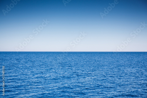 Red blue sea and light blue sky