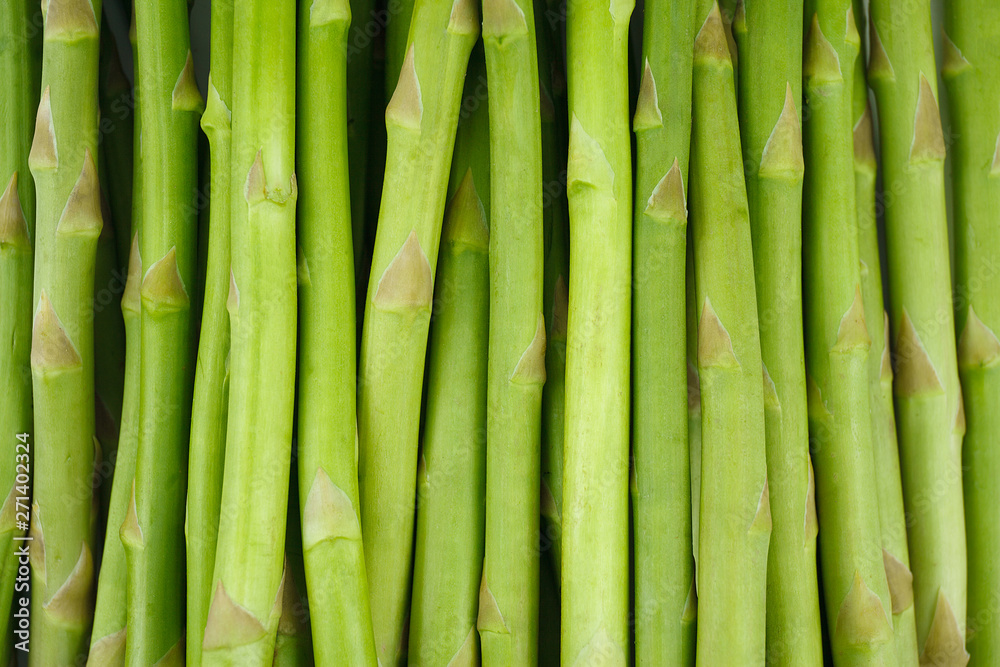 Fresh green asparagus on white background. Food ingredients. Health food Fresh green asparagus on white background. Food ingredients. Health food