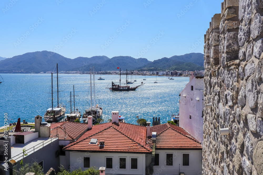 Marmaris / Turkey: View of harbor with boats and Castle (Marmaris Kalesi). Seascape at sunrise.