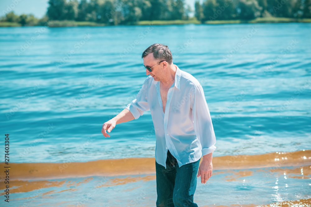 Mature European man with a good mood, outdoor portrait. The concept of life after 50 years Mature European man with a good mood, outdoor portrait. The concept of life after 50 years