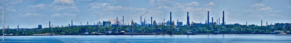 Panorama of the port and the factory industrial area with many pipes with smoke Panorama of the port and the factory industrial area with many pipes with smoke