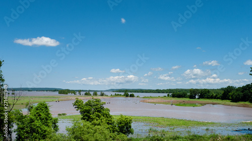 Farm equipment standing in flood water