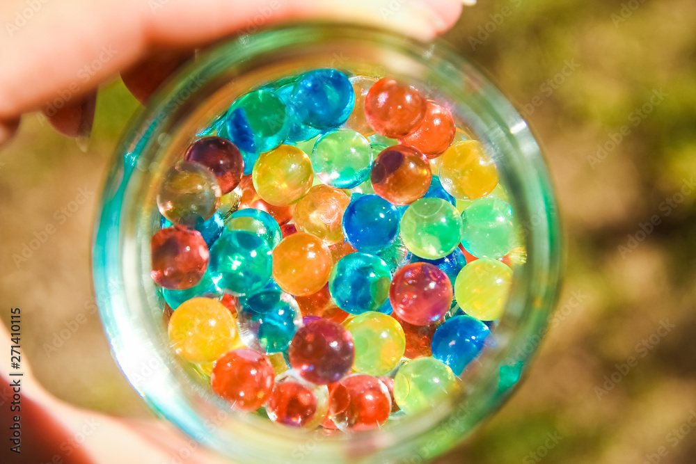 nice background of different colors balls in hands nice background of different colors balls in hands