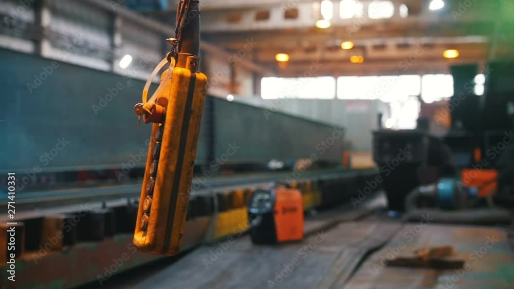 The control panel of the machines hangs on the wire and sways The control panel of the machines hangs on the wire and sways