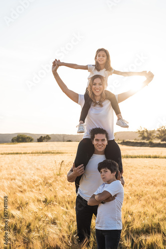 Happy and fun family in nature. Family in the country with arms open
