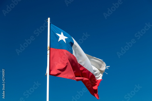 Chilean flag waving under blue sky