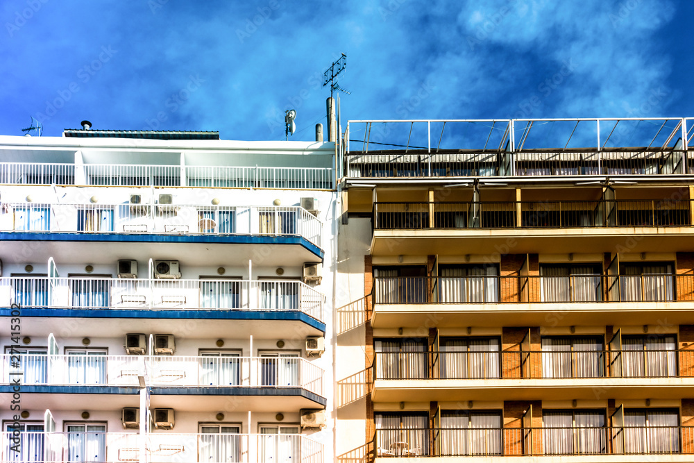 Residential apartments buildings with balconies and blue sky
